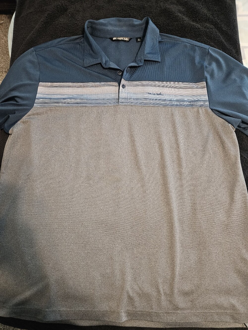 Travis Matthew.                  Men's Blue and Gray Performance Polo Shirt